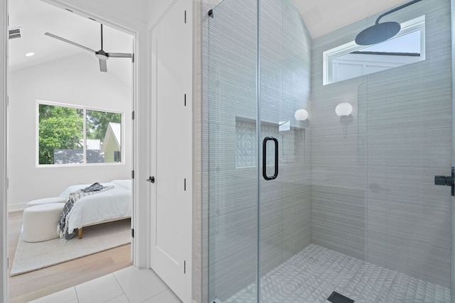 52 Robert T Martinez Jr St, Austin, TX 78702 - ensuite bathroom with a shower stall, tile patterned floors, a ceiling fan, and vaulted ceiling