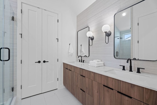 52 Robert T Martinez Jr St, Austin, TX 78702 - bathroom featuring a stall shower, tile patterned floors, double vanity, and tasteful backsplash