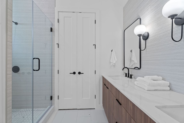 52 Robert T Martinez Jr St, Austin, TX 78702 - full bathroom with a shower stall, tile patterned floors, and double vanity