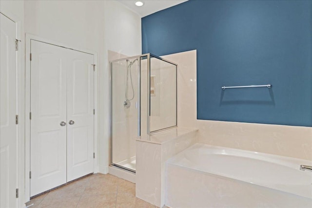 2210 Onion Creek Pkwy Unit 604, Austin, TX 78747 - full bath featuring a shower stall, a garden tub, tile patterned floors, and a closet