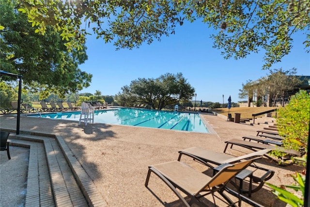 2210 Onion Creek Pkwy Unit 604, Austin, TX 78747 - community pool featuring a patio area