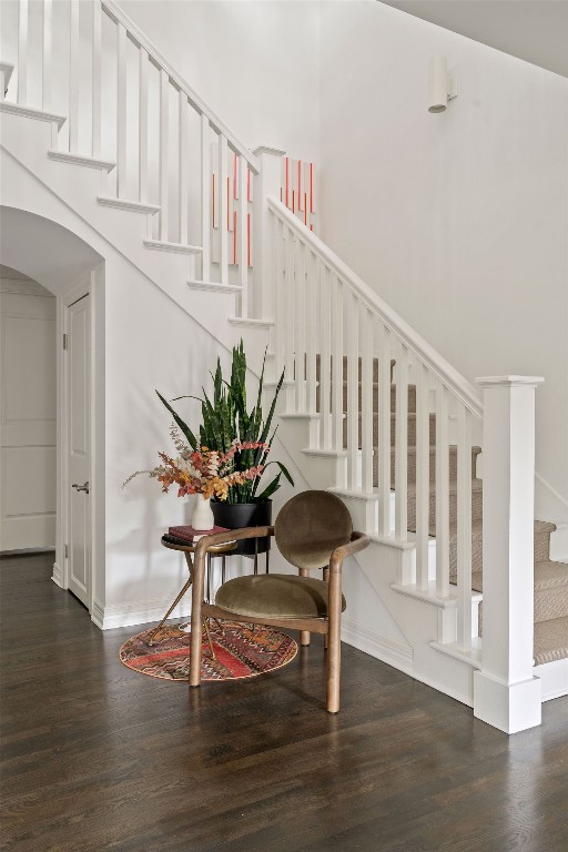 1711 Mohle Dr, Austin, TX 78703 - stairs featuring wood finished floors, arched walkways, and baseboards