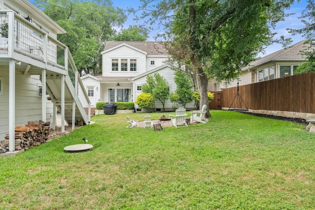 1711 Mohle Dr, Austin, TX 78703 - view of yard featuring stairs, a fire pit, and a deck