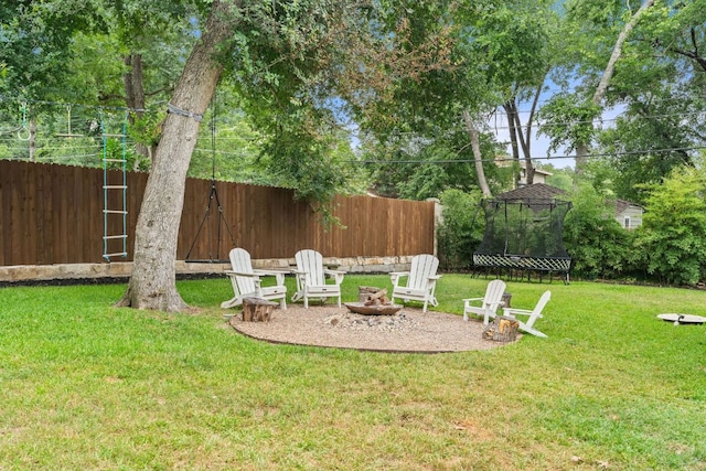 1711 Mohle Dr, Austin, TX 78703 - view of yard featuring a fire pit and a trampoline