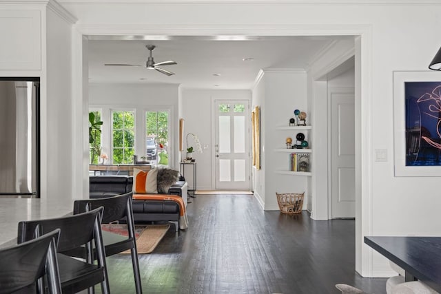 1711 Mohle Dr, Austin, TX 78703 - entryway with dark wood-style flooring, a ceiling fan, crown molding, and baseboards