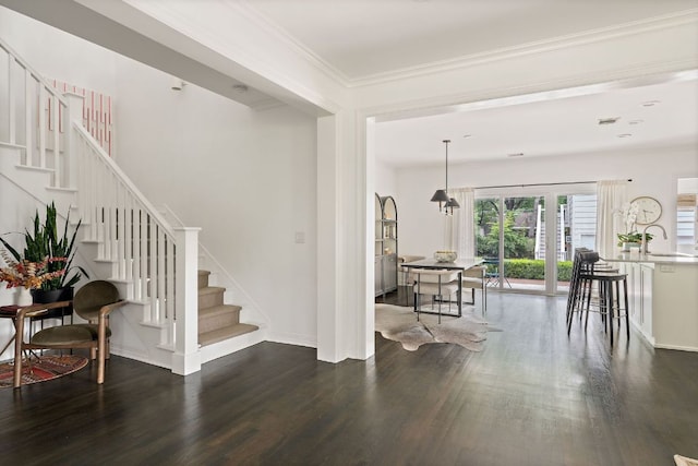 1711 Mohle Dr, Austin, TX 78703 - entryway with dark wood-style flooring, stairs, baseboards, and ornamental molding