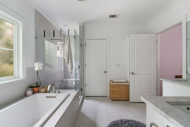 1711 Mohle Dr, Austin, TX 78703 - bathroom with crown molding, vanity, a shower stall, a garden tub, and tile patterned flooring
