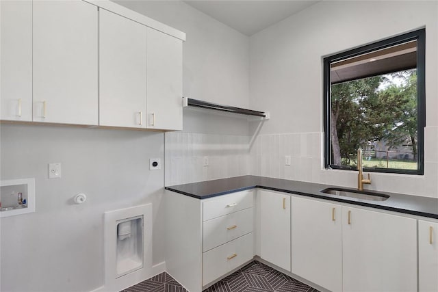 8341 Brewer Ln, Salado, TX 76571 - laundry room with cabinet space, washer hookup, and electric dryer hookup