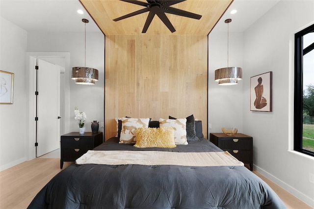 8341 Brewer Ln, Salado, TX 76571 - bedroom featuring wood finished floors, baseboards, multiple windows, and recessed lighting
