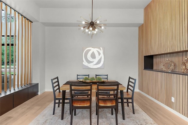 8341 Brewer Ln, Salado, TX 76571 - dining space featuring a chandelier, wood finished floors, and baseboards