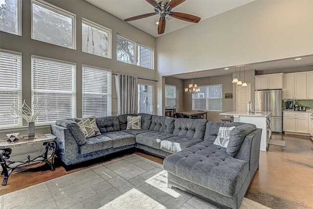4809 Bolm Rd, Austin, TX 78702 - living room with a chandelier, a high ceiling, a ceiling fan, and recessed lighting
