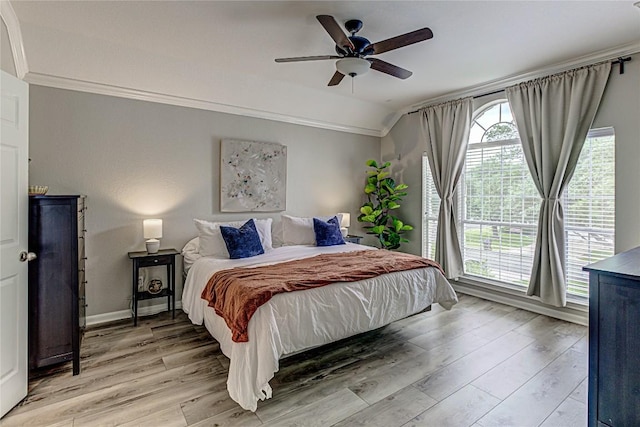8002 Magic Mountain Cv, Round Rock, TX 78681 - bedroom featuring light wood-type flooring, crown molding, vaulted ceiling, baseboards, and a ceiling fan
