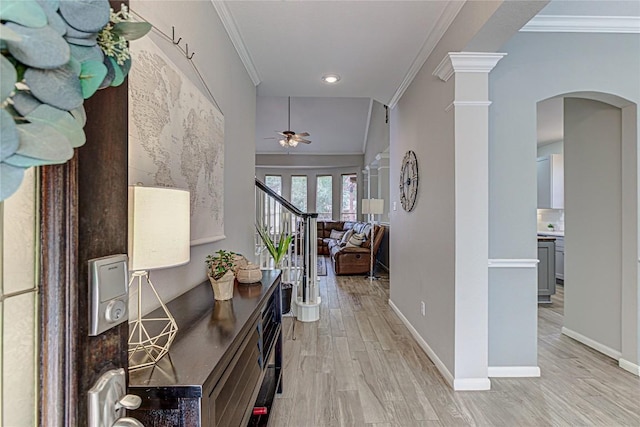 8002 Magic Mountain Cv, Round Rock, TX 78681 - corridor featuring arched walkways, light wood-style floors, crown molding, baseboards, and ornate columns