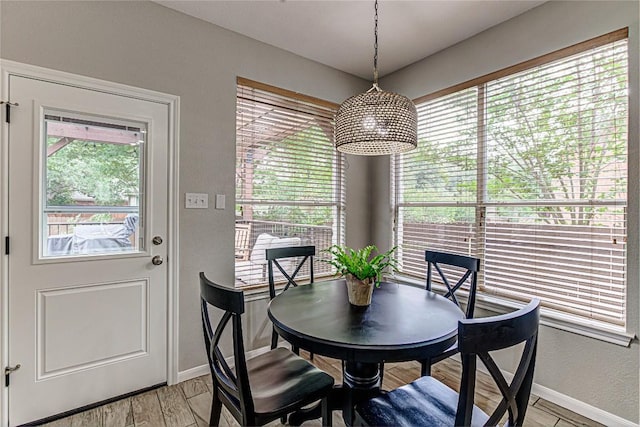 8002 Magic Mountain Cv, Round Rock, TX 78681 - dining area featuring baseboards and light wood-type flooring