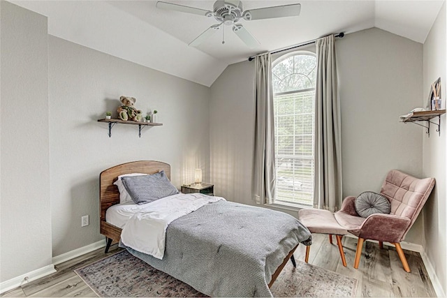 8002 Magic Mountain Cv, Round Rock, TX 78681 - bedroom with lofted ceiling, light wood-style flooring, baseboards, and a ceiling fan