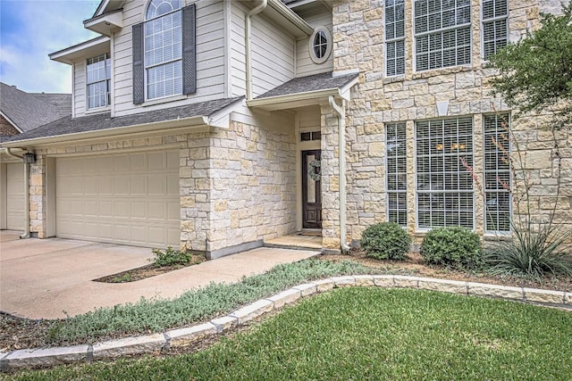8002 Magic Mountain Cv, Round Rock, TX 78681 - property entrance featuring stone siding, roof with shingles, a garage, and concrete driveway