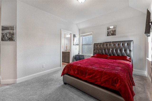 306 Pulitzer Dr, Hutto, TX 78634 - bedroom featuring carpet floors, lofted ceiling, baseboards, and connected bathroom