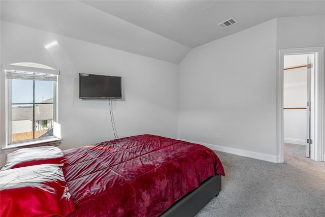 306 Pulitzer Dr, Hutto, TX 78634 - bedroom featuring carpet, vaulted ceiling, and baseboards