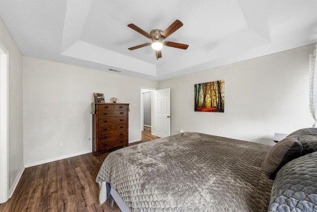 306 Southbrook Dr, Killeen, TX 76542 - bedroom with a tray ceiling, wood finished floors, baseboards, and ceiling fan