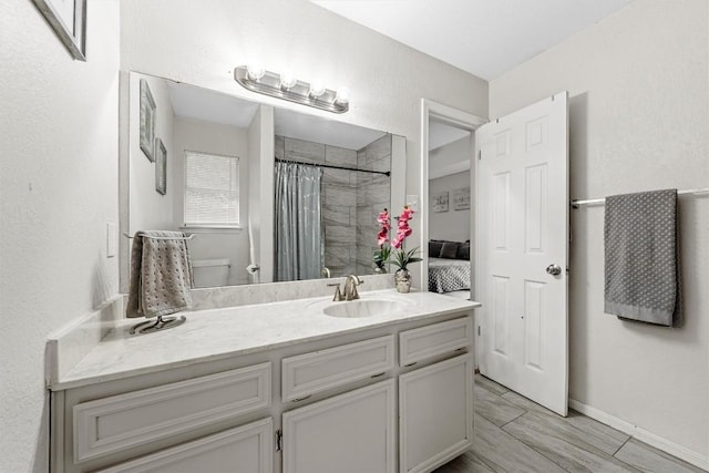 306 Southbrook Dr, Killeen, TX 76542 - bathroom featuring vanity, a shower with shower curtain, toilet, and baseboards