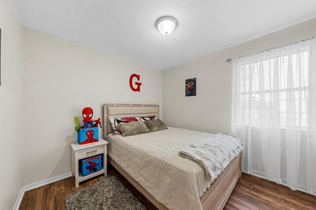 306 Southbrook Dr, Killeen, TX 76542 - bedroom featuring wood finished floors and baseboards