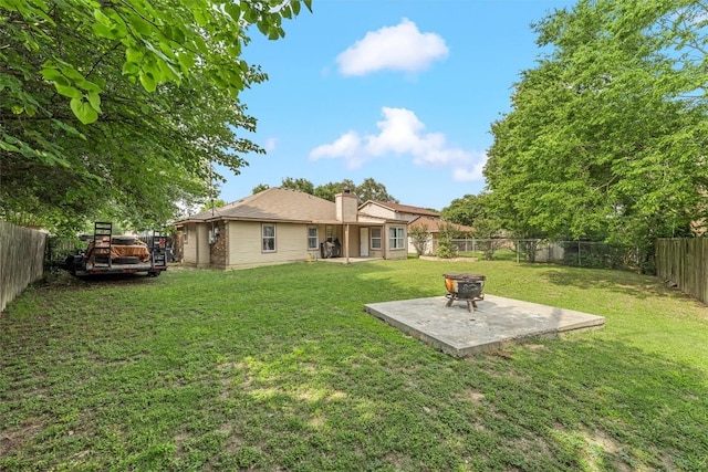 306 Southbrook Dr, Killeen, TX 76542 - back of house with a chimney, a patio area, and a fire pit