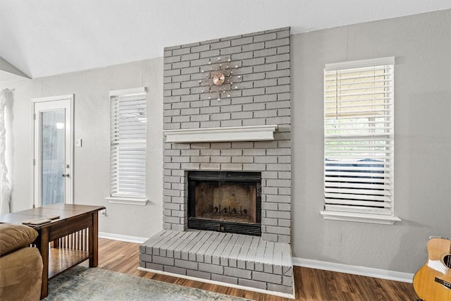 306 Southbrook Dr, Killeen, TX 76542 - living room with wood finished floors, a fireplace, baseboards, and plenty of natural light