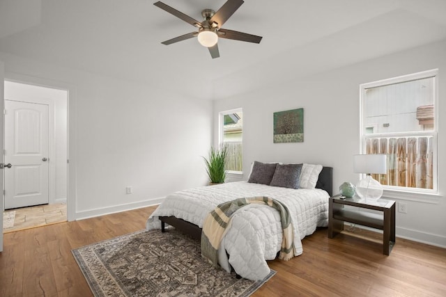 2310 Windsong Trl, Round Rock, TX 78664 - bedroom with baseboards, wood finished floors, and ceiling fan
