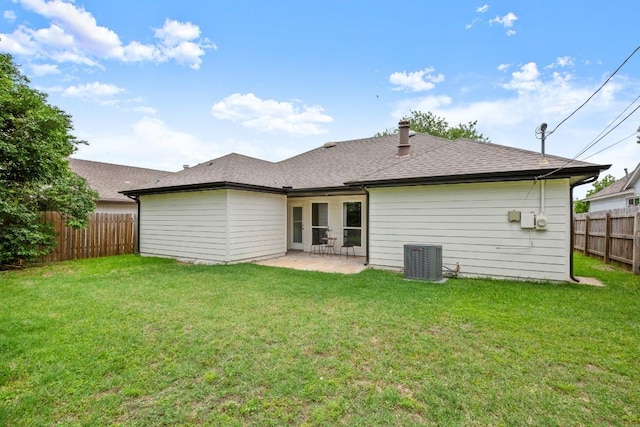 2310 Windsong Trl, Round Rock, TX 78664 - back of house featuring central air condition unit, a patio area, and a shingled roof