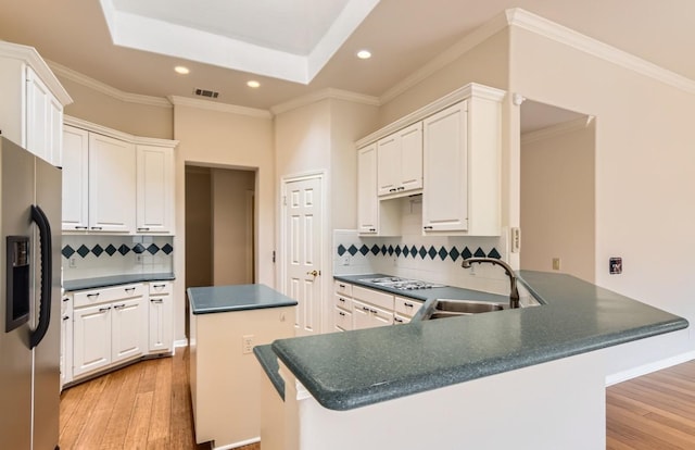 6901 W Bright Star Ln W, Austin, TX 78736 - kitchen with stainless steel fridge with ice dispenser, recessed lighting, dark countertops, light wood-type flooring, and ornamental molding
