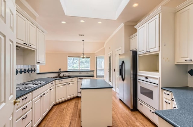 6901 W Bright Star Ln W, Austin, TX 78736 - kitchen with white oven, stainless steel fridge with ice dispenser, dishwasher, dark countertops, and gas stovetop
