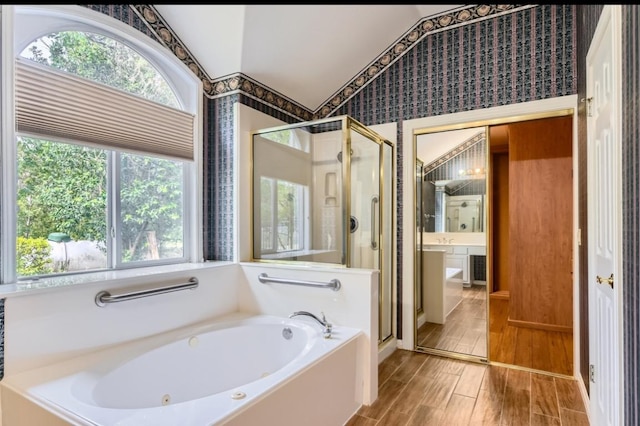 6901 W Bright Star Ln W, Austin, TX 78736 - full bathroom with a tub with jets, a stall shower, vaulted ceiling, wood finished floors, and wallpapered walls