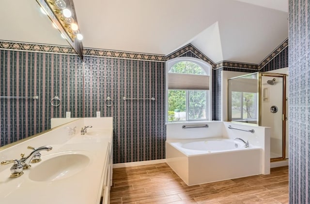 6901 W Bright Star Ln W, Austin, TX 78736 - bathroom with wallpapered walls, lofted ceiling, a garden tub, a shower stall, and wood finished floors
