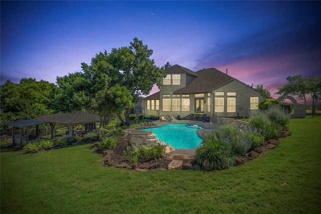 1701 Mira Vis, Leander, TX 78641 - pool at dusk with a gazebo, a yard, an outdoor pool, and a patio area