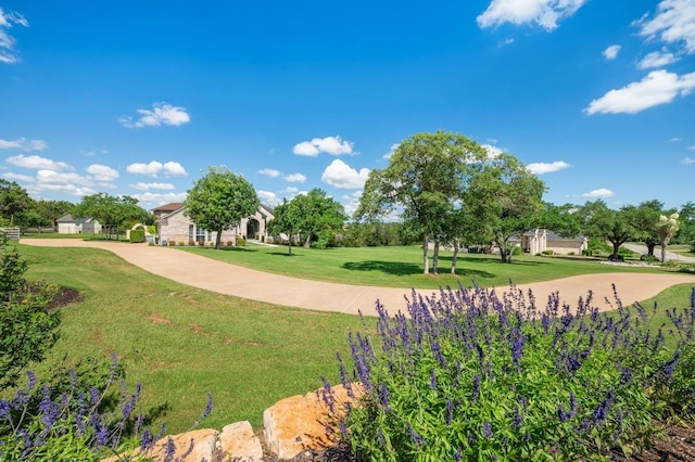 1701 Mira Vis, Leander, TX 78641 - view of property's community with a yard, curved driveway, and golf course view