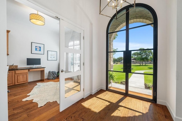1701 Mira Vis, Leander, TX 78641 - doorway featuring a desk, wood finished floors, a chandelier, french doors, and baseboards
