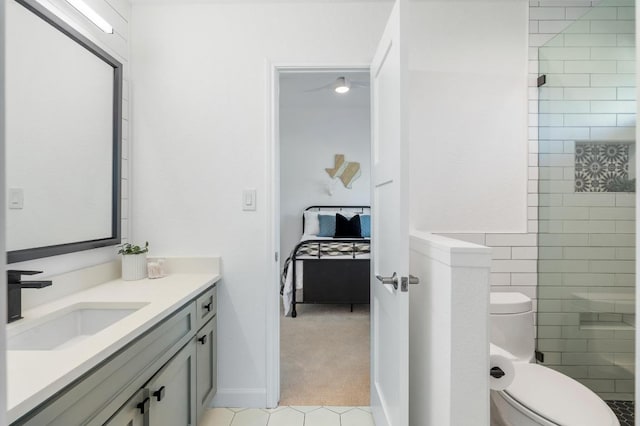 1701 Mira Vis, Leander, TX 78641 - bathroom featuring vanity, connected bathroom, tile patterned floors, and tiled shower