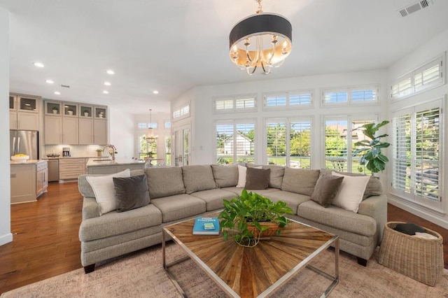 1701 Mira Vis, Leander, TX 78641 - living room with a chandelier, recessed lighting, and light wood finished floors