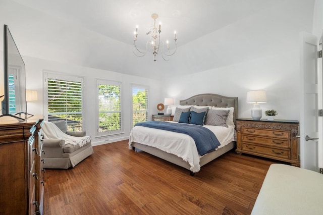 1701 Mira Vis, Leander, TX 78641 - bedroom with a chandelier, wood finished floors, and vaulted ceiling