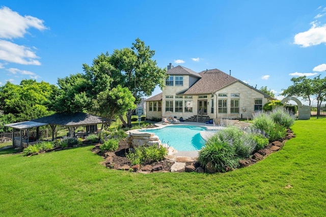 1701 Mira Vis, Leander, TX 78641 - back of house with a gazebo, a lawn, a chimney, a patio, and entry steps