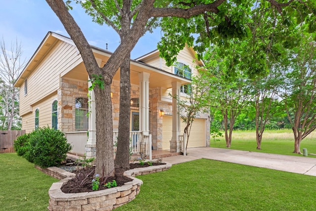 2100 Campfield Pkwy, Austin, TX 78745 - view of front of house featuring stone siding, a porch, driveway, and a garage