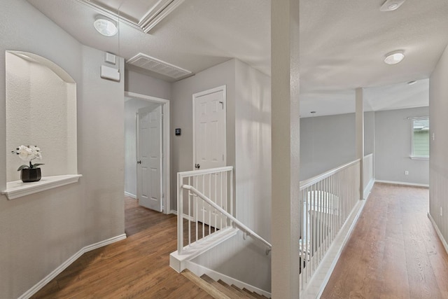 2100 Campfield Pkwy, Austin, TX 78745 - corridor with attic access, an upstairs landing, wood finished floors, and baseboards