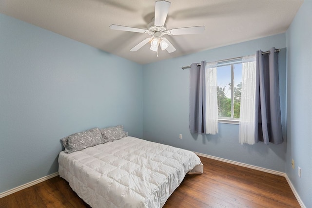 2100 Campfield Pkwy, Austin, TX 78745 - bedroom with wood finished floors, baseboards, and ceiling fan