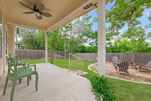 2100 Campfield Pkwy, Austin, TX 78745 - fenced backyard with a patio and a ceiling fan