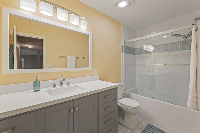 2100 Campfield Pkwy, Austin, TX 78745 - full bath featuring toilet, vanity, bath / shower combo with glass door, and tile patterned floors