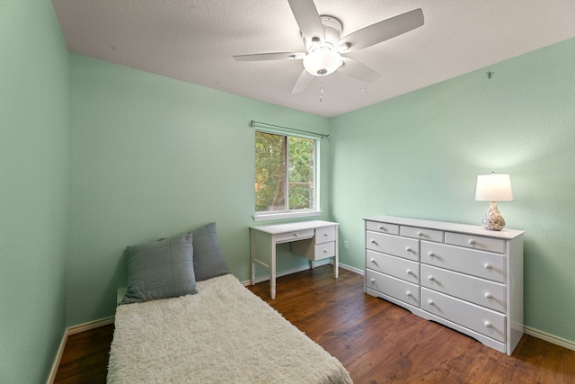 2100 Campfield Pkwy, Austin, TX 78745 - bedroom with dark wood finished floors, baseboards, and ceiling fan