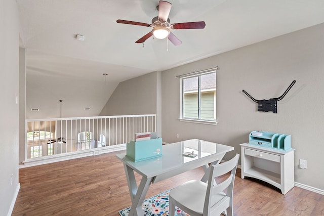 2100 Campfield Pkwy, Austin, TX 78745 - home office with a ceiling fan, wood finished floors, vaulted ceiling, and baseboards