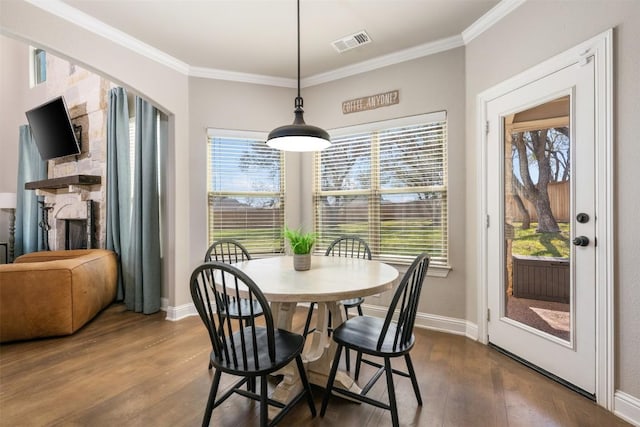 2015 Th Jones Mill Way, Salado, TX 76571 - dining room with dark wood finished floors, ornamental molding, plenty of natural light, and baseboards
