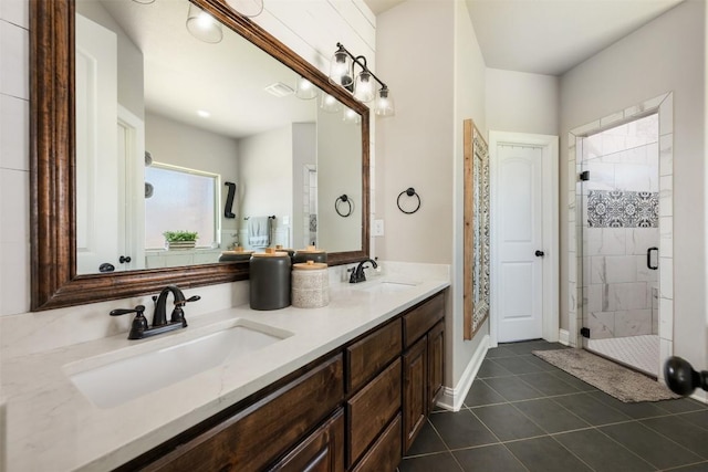 2015 Th Jones Mill Way, Salado, TX 76571 - bathroom featuring a shower stall, tile patterned floors, double vanity, and baseboards