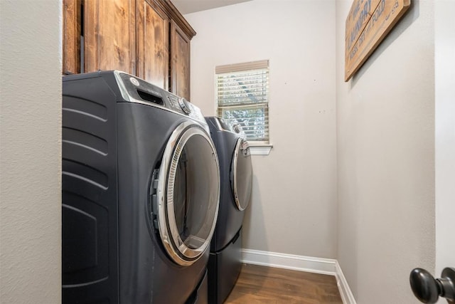 2015 Th Jones Mill Way, Salado, TX 76571 - washroom featuring washing machine and dryer, baseboards, dark wood finished floors, and cabinet space